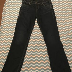 Silver high rise skinny jeans.